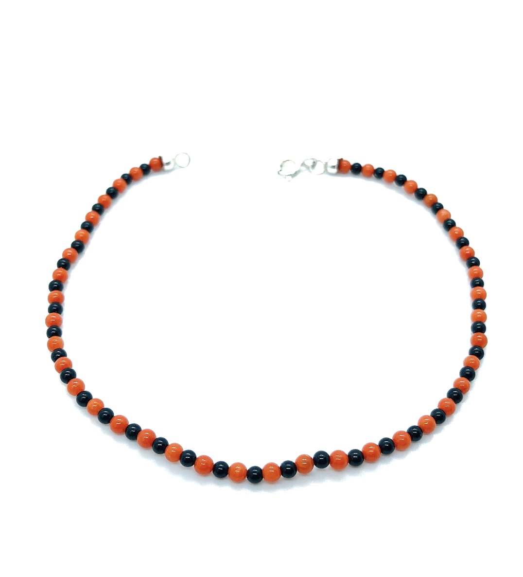 Bracciale in corallo con sfera con in onice